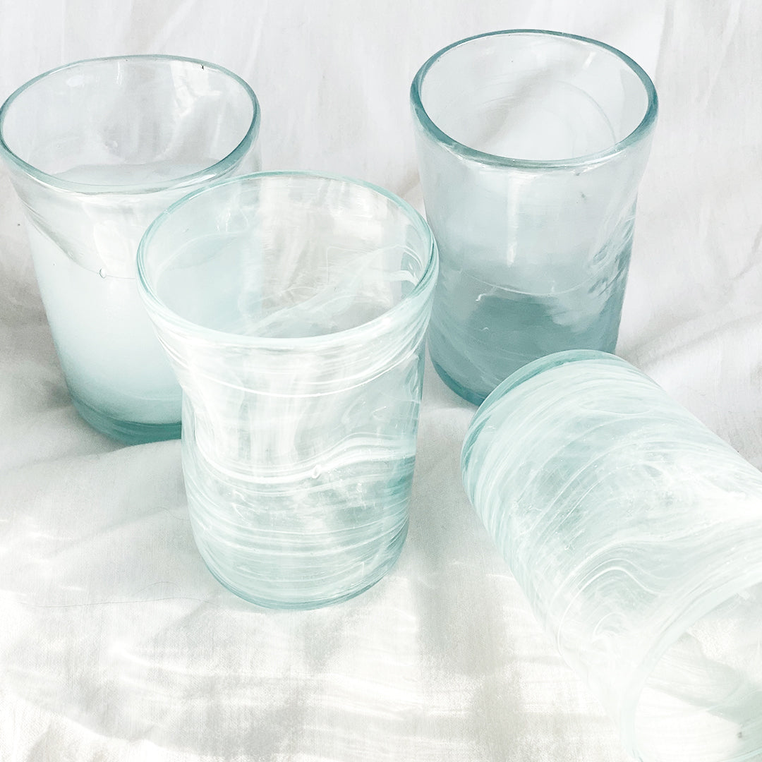 Elevate your sipping experience with our Deformed White Arak Mini Cups, exquisite blown glass creations proudly crafted in Lebanon. Each mini cup is a vibrant swirl of white bringing joy and charm to your table.
