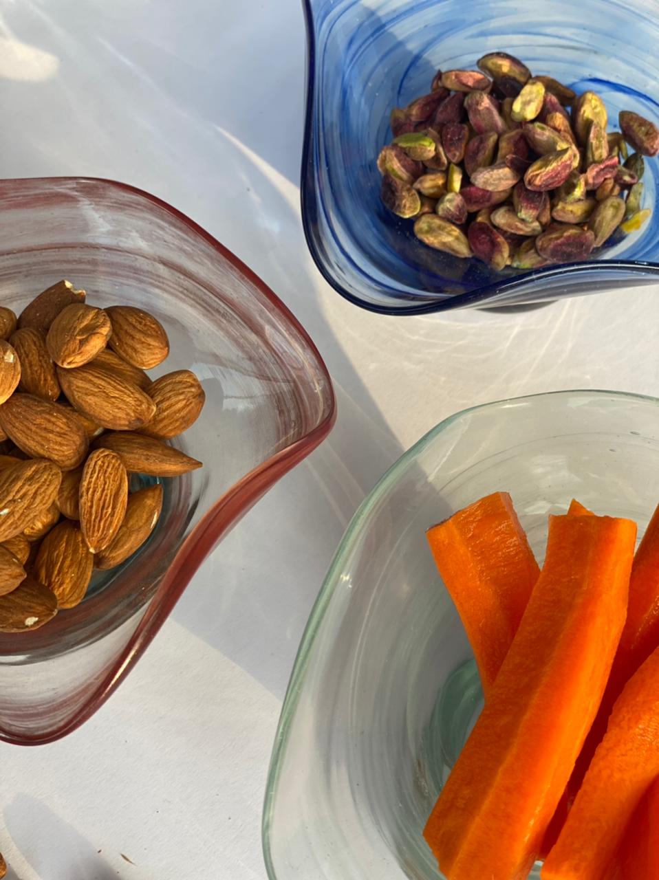 Dive into a world of vivid hues and environmentally-friendly living with this stunning snack bowl ensemble. The recycled glass not only adds a unique texture but also tells a tale of repurposing, making each piece a work of art.